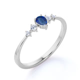 Petite 0.49 Carat Pear Vivid Blue Sapphire and 5 Stone Diamond Tapered Shank Engagement Ring in White Gold