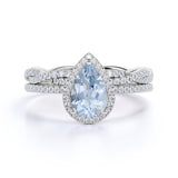 Art Deco 1.75 Carat Pear Cut Aquamarine and Moissanite Infinity Wedding Ring Set in 18k White Gold over Silver