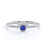Petite Round Cut Deep Blue Sapphire and Diamond Curve Engagement Ring in White Gold