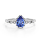 Bezel Set 1.25 Carat Pear Deep Blue Sapphire and Diamond Unique Milgrain Engagement Ring in White Gold