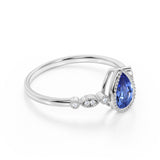 Bezel Set 1.25 Carat Pear Deep Blue Sapphire and Diamond Unique Milgrain Engagement Ring in White Gold