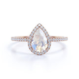 1.50 Carat Pear Shaped Blue Moonstone and Moissanite Halo Engagement Ring in 18k Rose Gold over Silver