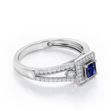 Split-Shanked Pave 1.55 Carat Princess Cut Blue Sapphire and diamond Milgrain-Bordered Halo Engagement Ring in White Gold