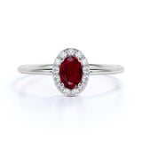 Dainty 0.65 Carat Oval Shape Lab Ruby and Diamond Halo Classic Engagement Ring in White Gold