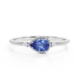 Sideways 1.05 Carat Pear Navy Blue Lab-Created Sapphire and 3 Stone Diamond Elegant Engagement Ring in White Gold
