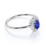 Dainty 0.65 Carat Oval Shape Navy Blue Sapphire and Diamond Halo Classic Engagement Ring in White Gold