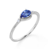 Sideways 1.05 Carat Pear Navy Blue Lab-Created Sapphire and 3 Stone Diamond Elegant Engagement Ring in White Gold