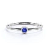 Bezel Set Round Midnight Blue Lab-Created Sapphire and Petite Solitaire Engagement Ring in White Gold