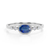 Bestselling East West 1.10 Carat Oval Cut Vivid Blue Sapphire and Diamond Bezel Engagement Ring in White Gold