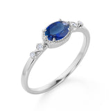 Bestselling East West 1.10 Carat Oval Cut Vivid Blue Sapphire and Diamond Bezel Engagement Ring in White Gold