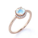 Unique 1.15 Carat Round Blue Flash Moonstone and Diamond Curved Engagement Ring in Rose Gold