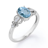 Swirly 0.5 carat Oval Aquamarine and Diamonds Antique Engagement Ring in Rose Gold
