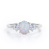 Three Stone 1.1 Ct Oval Cut Lab Created Opal Engagement Ring