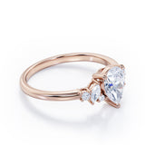 Fashionable 7 Stones 0.6 carat Pear Moissanite and Diamond Engagement Ring in Rose Gold