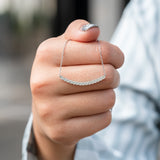 Curved Bar Round-Shaped Moissanite Pendant Necklace in 18K White Gold over Silver