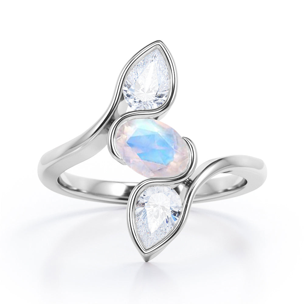 Distorted Line Three Stone 1 carat Oval and Pear Moonstone and moissanite Ring in Rose Gold