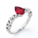 Vintage Style Scroll 0.5 carat Pear Lab Ruby and Diamond Engagement Ring in Rose Gold
