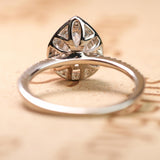 1.50 Carat Pear Cut Moissanite and Diamond Halo Engagement Ring in White Gold