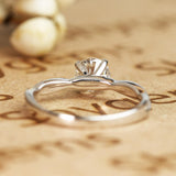 Cathedral Prong 1.25 Carat Round Shaped Moissanite Half Pave Infinity Twisted Shank Engagement Ring In 18K White Gold Plating Over Silver