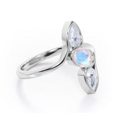 Distorted Line Three Stone 1 carat Oval and Pear Moonstone and moissanite Ring in Rose Gold