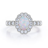 Vintage Floral Halo 0.7 carat Oval and Round Opal and diamond Engagement Ring in Rose Gold