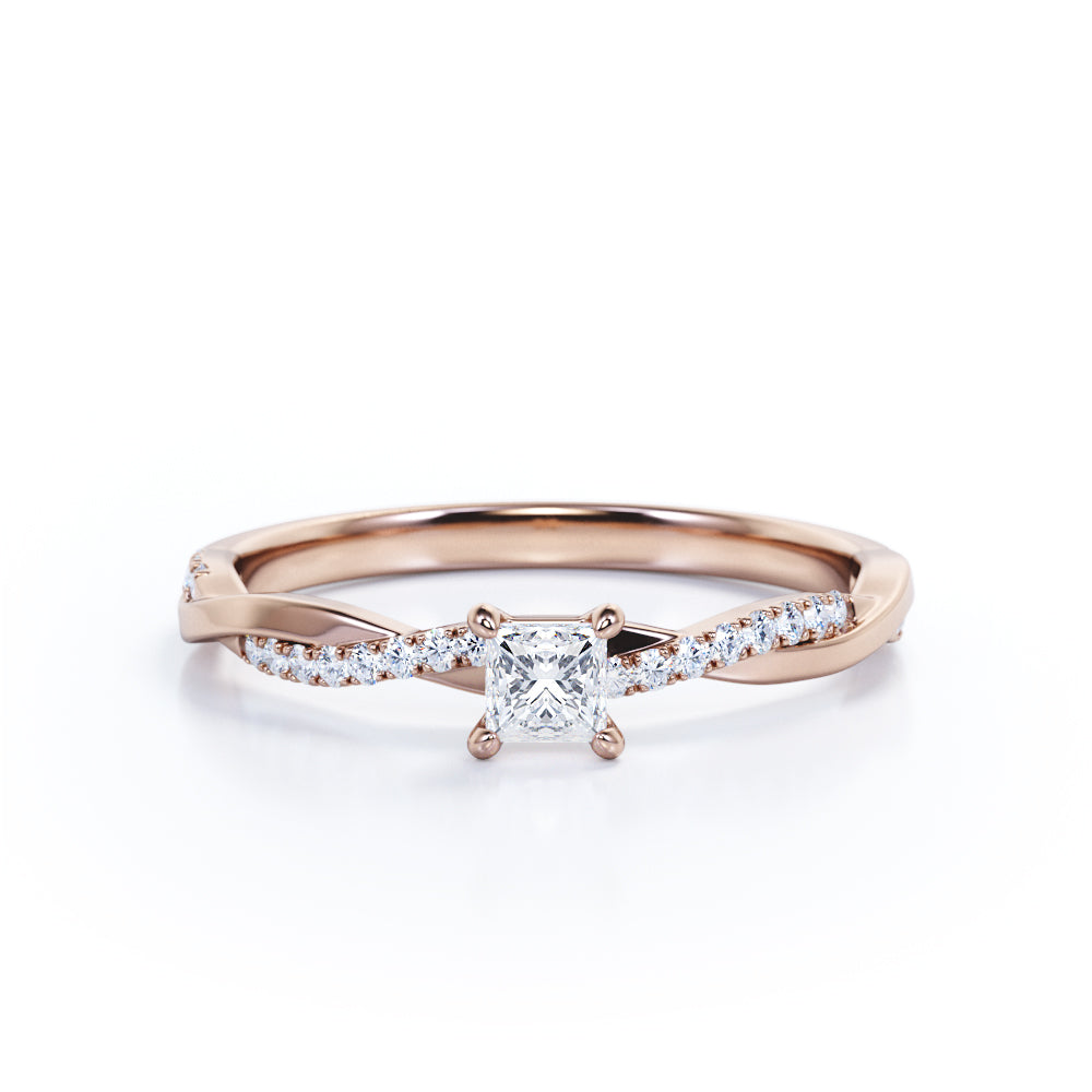 A Refined 0.7 carat Princess Moissanite and Diamond Twisted Shank Engagement Ring in White Gold