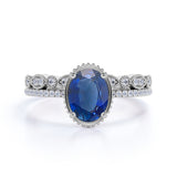 Vintage Bezel Set 1.50 Carat Oval Cut Sapphire and Diamond Art Deco Wedding Ring Set in White Gold