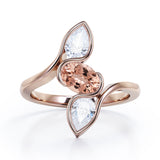 Distorted Line Three Stone 1 carat Oval and Pear Morganite and moissanite Ring in Rose Gold