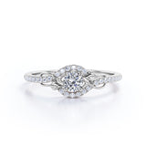 Swirl Halo 1 Carat Round Colorless Moissanite and Diamond French Pave Engagement Ring in Rose Gold