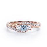 Trellis Three Stones 1 carat Princess Aquamarine and Moissanites Braided Engagement Ring in Rose Gold
