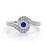 Wrapped Round 0.65 carat Round Blue Sapphire and Moissanites Bypass Engagement Ring in White Gold