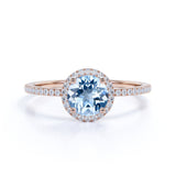 1.50 Carat Round cut Aquamarine and Diamond Halo Engagement Ring in Rose Gold
