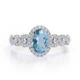 Twisted 1.45 Carat Oval Cut Aquamarine And Diamond Halo Engagement Ring In White Gold