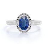 Antique Milgrain 1.25 Carat Oval cut Sapphire and Diamond Halo Engagement Ring in White Gold