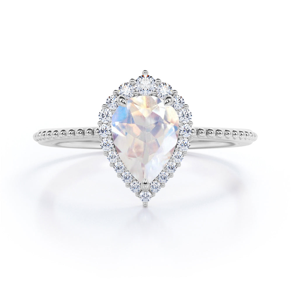 Beaded Band 0.7 carat Pear Moonstone and Moissanite Halo Anniversary Ring in Black gold