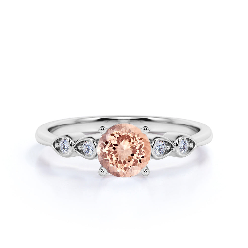 Four Prong Set 1.15 Carat Round Cut Morganite and Four Stone Diamond Engagement Ring in Rose Gold