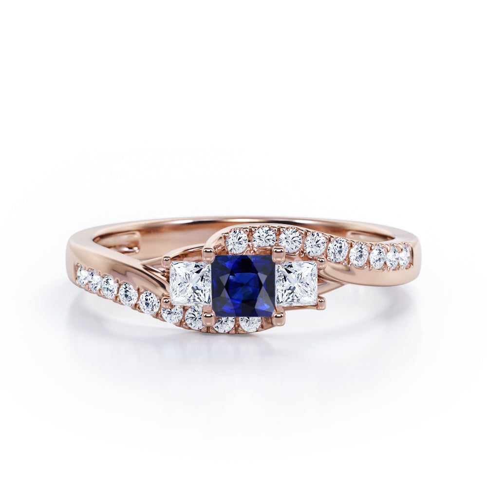 Trellis Three Stones 1 carat Princess Blue Sapphire and Moissanites Braided Engagement Ring in White Gold