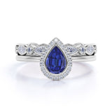 Classic Bezel Set 2.25 Carat Pear Cut Sapphire and Diamond Halo Wedding Set with Art Deco Eternity Band in White Gold