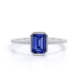 Stunning Bezel Set 1.25 Carat Emerald Cut Sapphire and Diamond Micro Pave Engagement Ring in White Gold