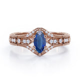 Beaded Framed 1.25 Carat Marquise Cut Sapphire And Diamond Vintage Filigree Engagement Ring In Rose Gold