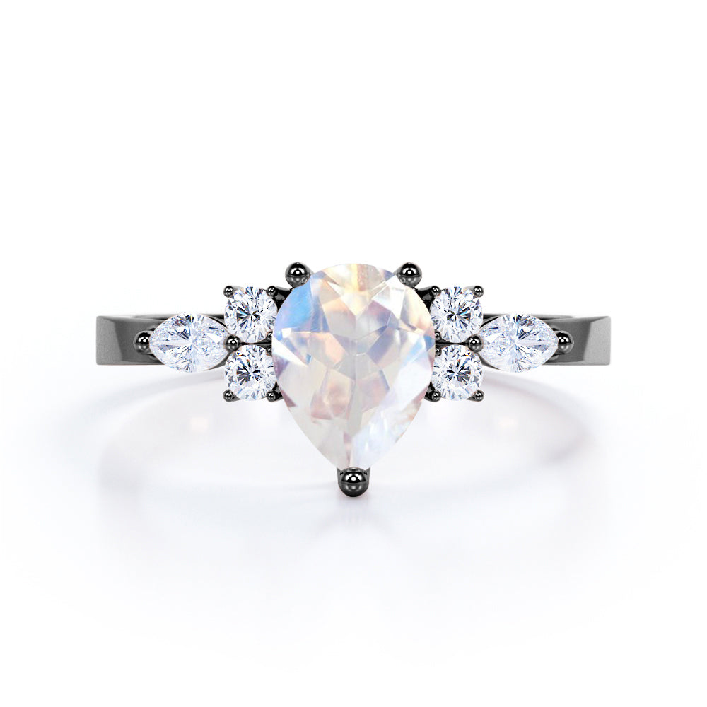 Adularescent Five Stone 0.55 carat Pear Cut Moonstone and Moissanite Engagement Ring in Rose Gold