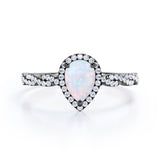Twisted 1.45 Ct Pear Cut Lab Created Opal Engagement Ring