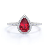 Elegant Pave 1.50 Carat Pear Shape Lab Ruby and Diamond Halo Engagement Ring in White Gold