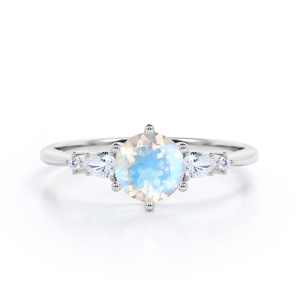 Balancing 5 stones 0.55 carat Round Moonstone and Moissanite Engagement Ring in Rose Gold