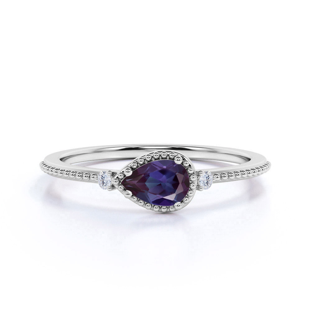 Dainty 0.60 Carat Pear Cut Lab Made Alexandrite and Diamond Three Stone Milgrain Engagement Ring
