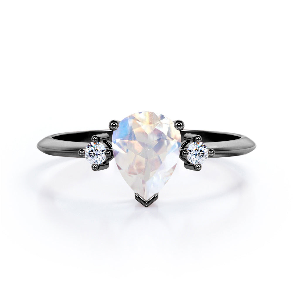 Minimal Three Stone 0.55 carat Pear Moonstone and Moissanite Prong Engagement Ring in Rose Gold