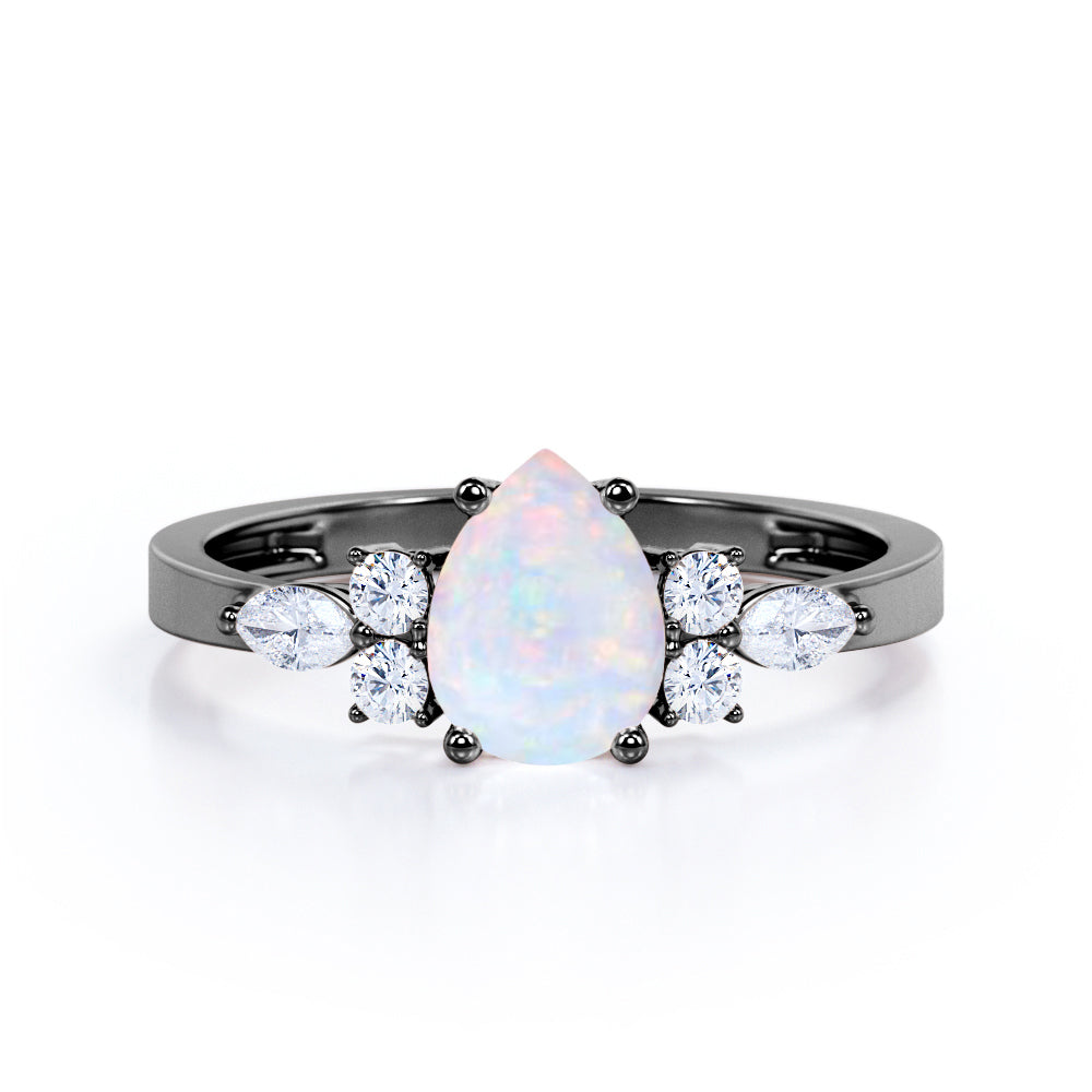 Four Prong Basket Set 1.35 Carat Pear Cut Ethiopian Opal And Diamond Seven Stone Engagement Ring In White Gold