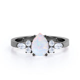 Four Prong Basket Set 1.35 Carat Pear Cut Ethiopian Opal And Diamond Seven Stone Engagement Ring In White Gold