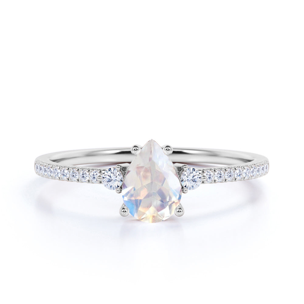 Surface Prong Set 1.50 Carat Pear White Blue Moonstone and Diamond Engagement Ring in Rose Gold