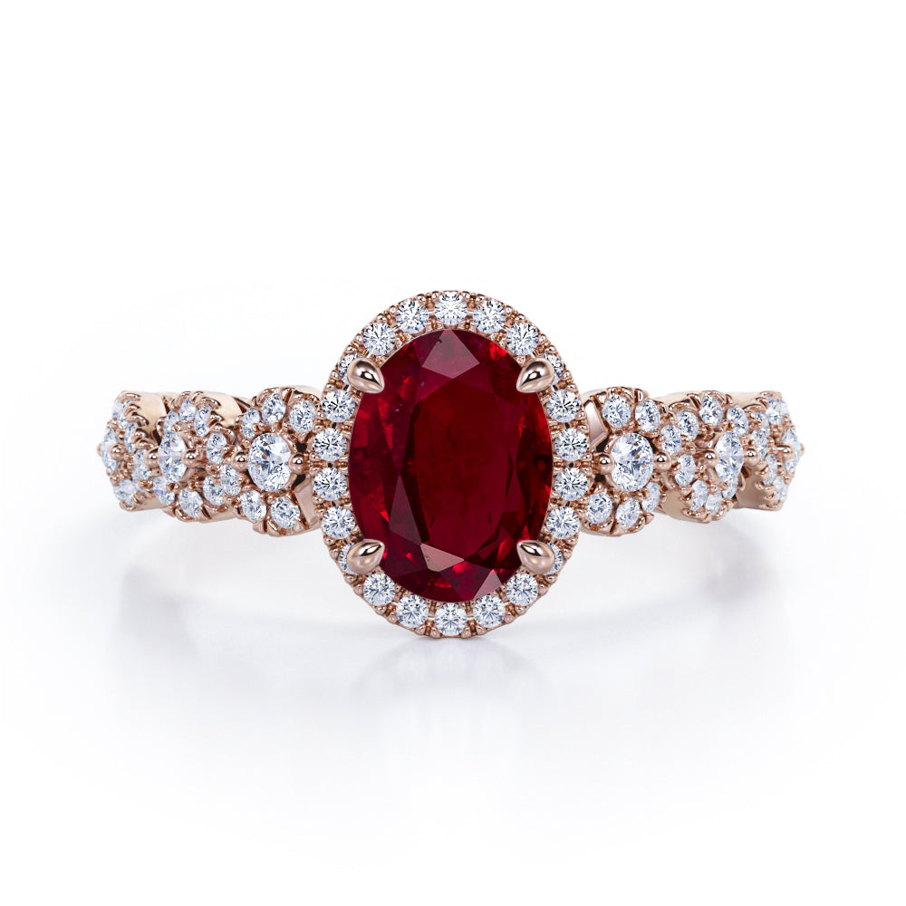 Twisted 1.45 Carat Oval Cut Ruby And Diamond Halo Engagement Ring In White Gold